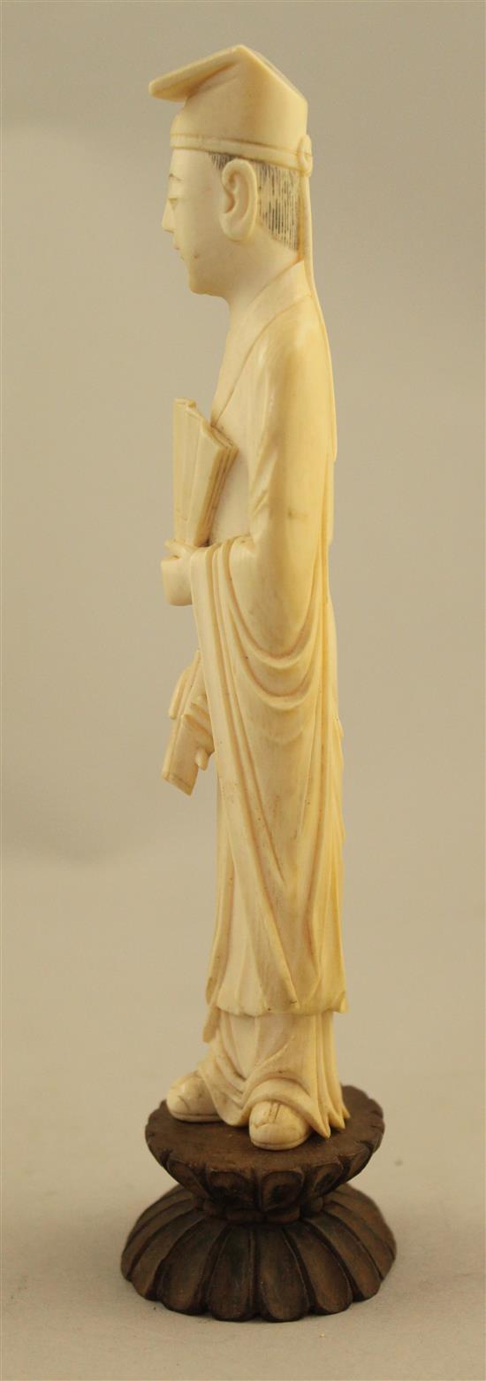 A Chinese ivory figure of a scholar, early 20th century, 17.5cm incl. stand, fitted box